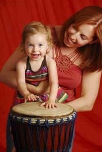 Mom and daughter playing the drums